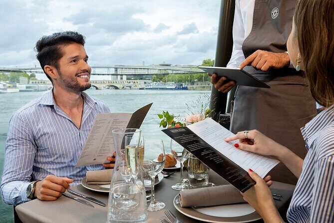 Bateaux Parisiens Seine River Gourmet Lunch & Sightseeing Cruise - The boat experience: glass canopy views and private-table dining