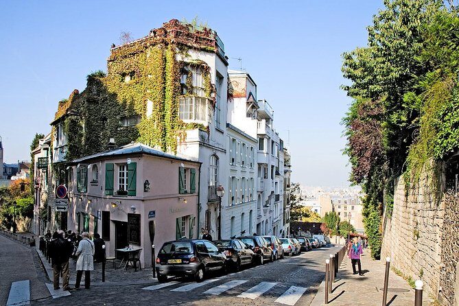 Montmartre Hidden Gems and Scenic Highlights Walking Tour - Moulin de la Galette: the windmill that still looks like a stage prop