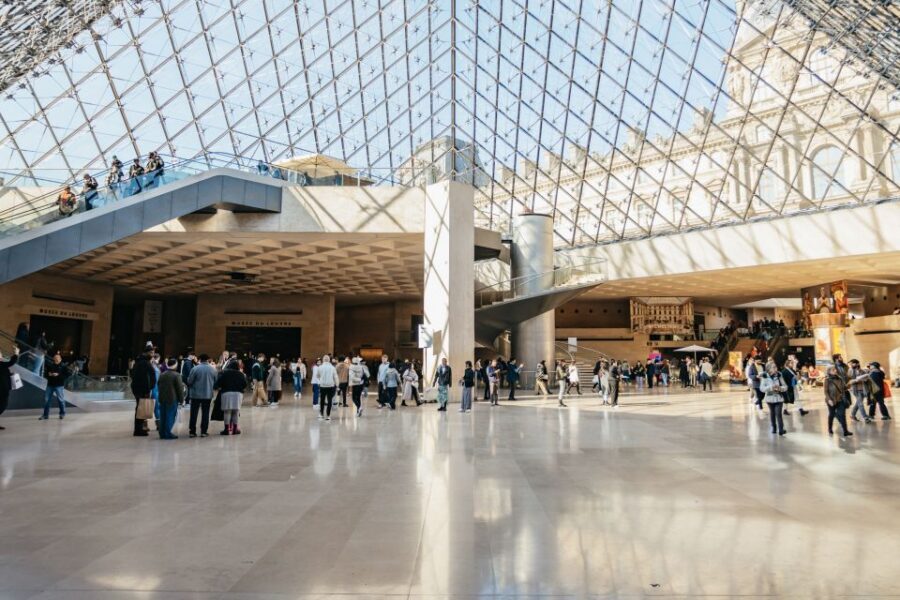 Paris: Louvre Museum Entry Ticket With Host and River Cruise - The digital audio guide app: helpful context, not the official museum system