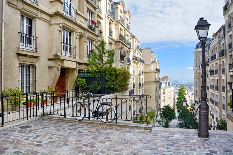 Paris: Montmartre Hidden Gems and Highlights Walking Tour - Moulin de la Galette and Rue des Abbesses: Art Anchors in Real Streets