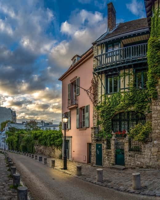 Paris: Montmartre Highlights Walking Tour with a Local Guide - Place Saint-Pierre to Sacré-Cœur Views: Getting Your Bearings Fast