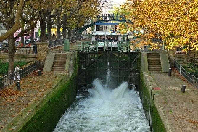 Seine River Cruise and Paris Canals Tour - Seine river highlights: Louvre and Notre-Dame from the water