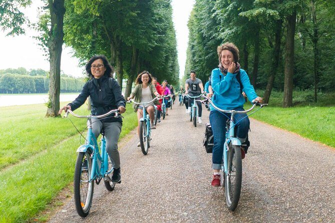 Versailles Palace Bike Tour with Market & Marie-Antoinette hamlet - Guides, bikes, and rainy-day sanity